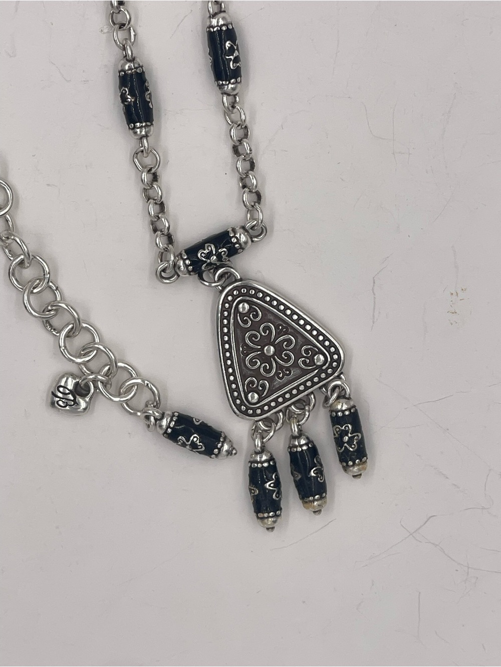 Brighton Jordana Retired Pendan featuring a silver charm and black enamel